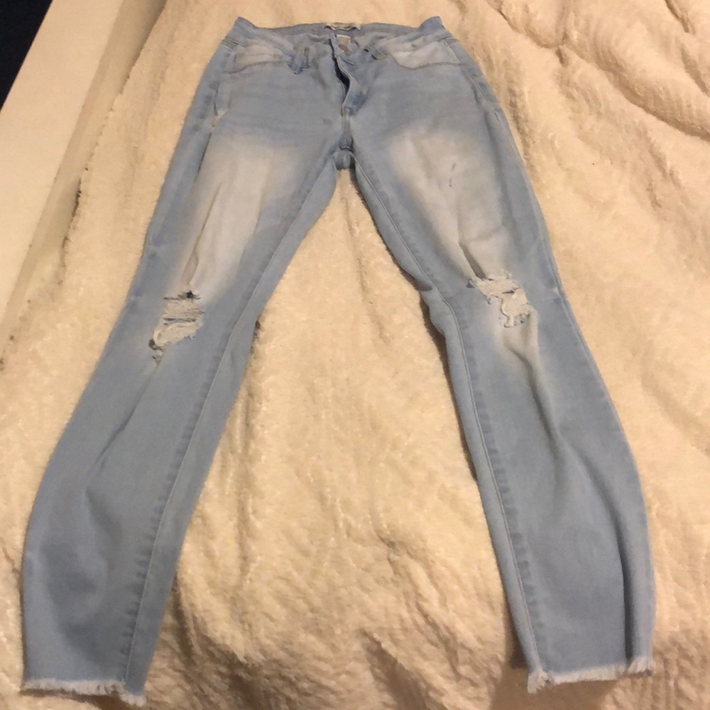 light blue distressed jeans